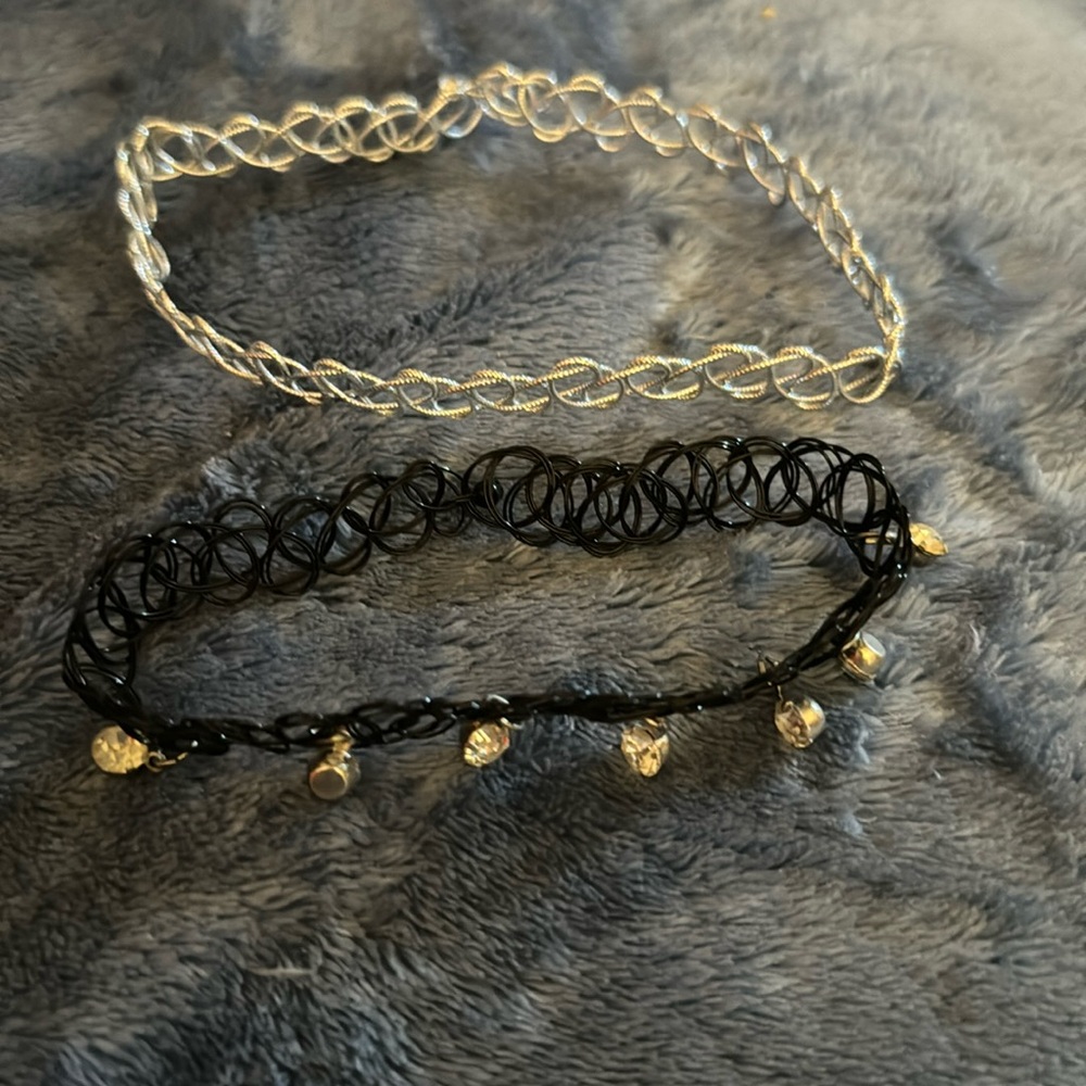 Set of 2 chokers. One silver and one black with rhinestones